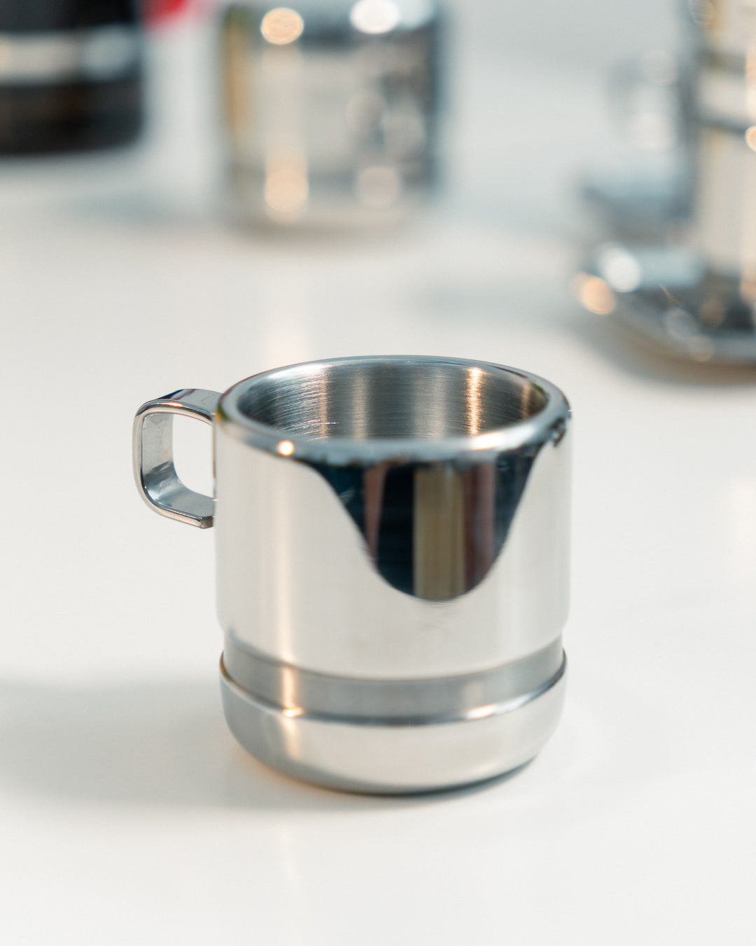 1980s Vintage Zini Italy double-walled stainless steel espresso set with cups, saucers, spoons and sugar server. Vecino Shop