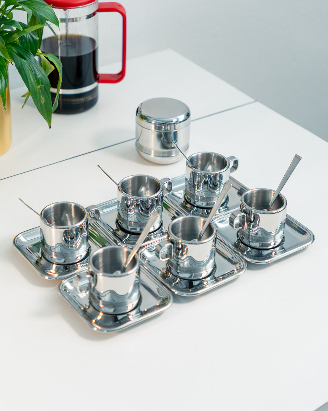 1980s Vintage Zini Italy double-walled stainless steel espresso set with cups, saucers, spoons and sugar server. Vecino Shop