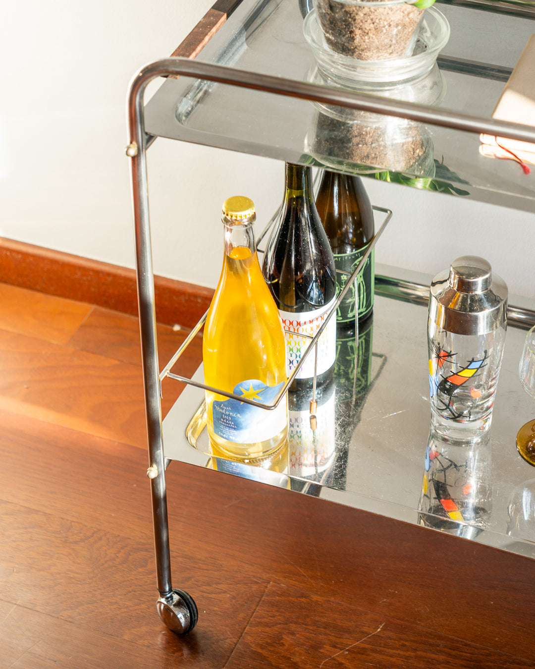 Vintage mid century modern stainless steel and chrome two-tier bar cart with teak handles and bottle divider, 1970s