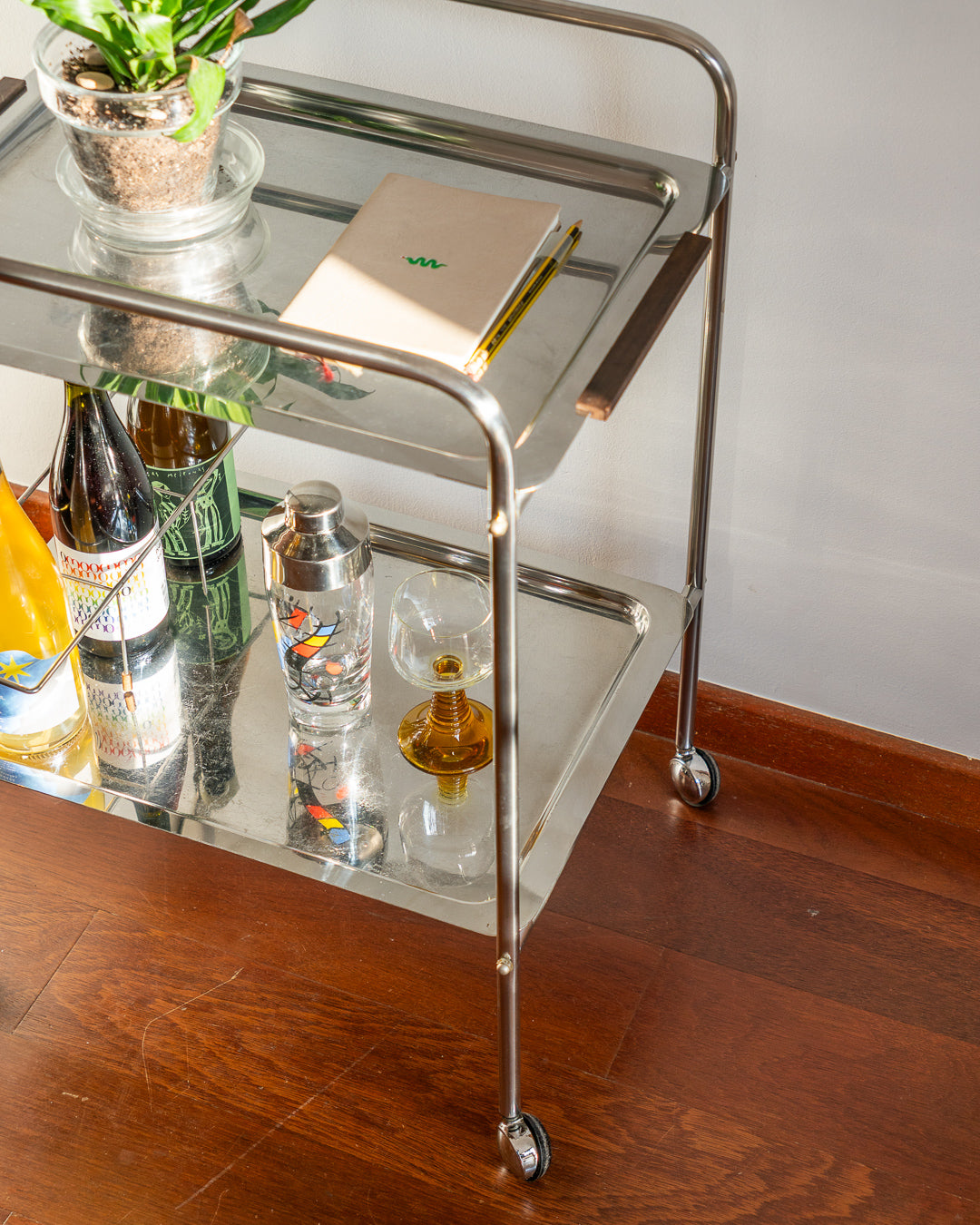Vintage mid century modern stainless steel and chrome two-tier bar cart with teak handles and bottle divider, 1970s