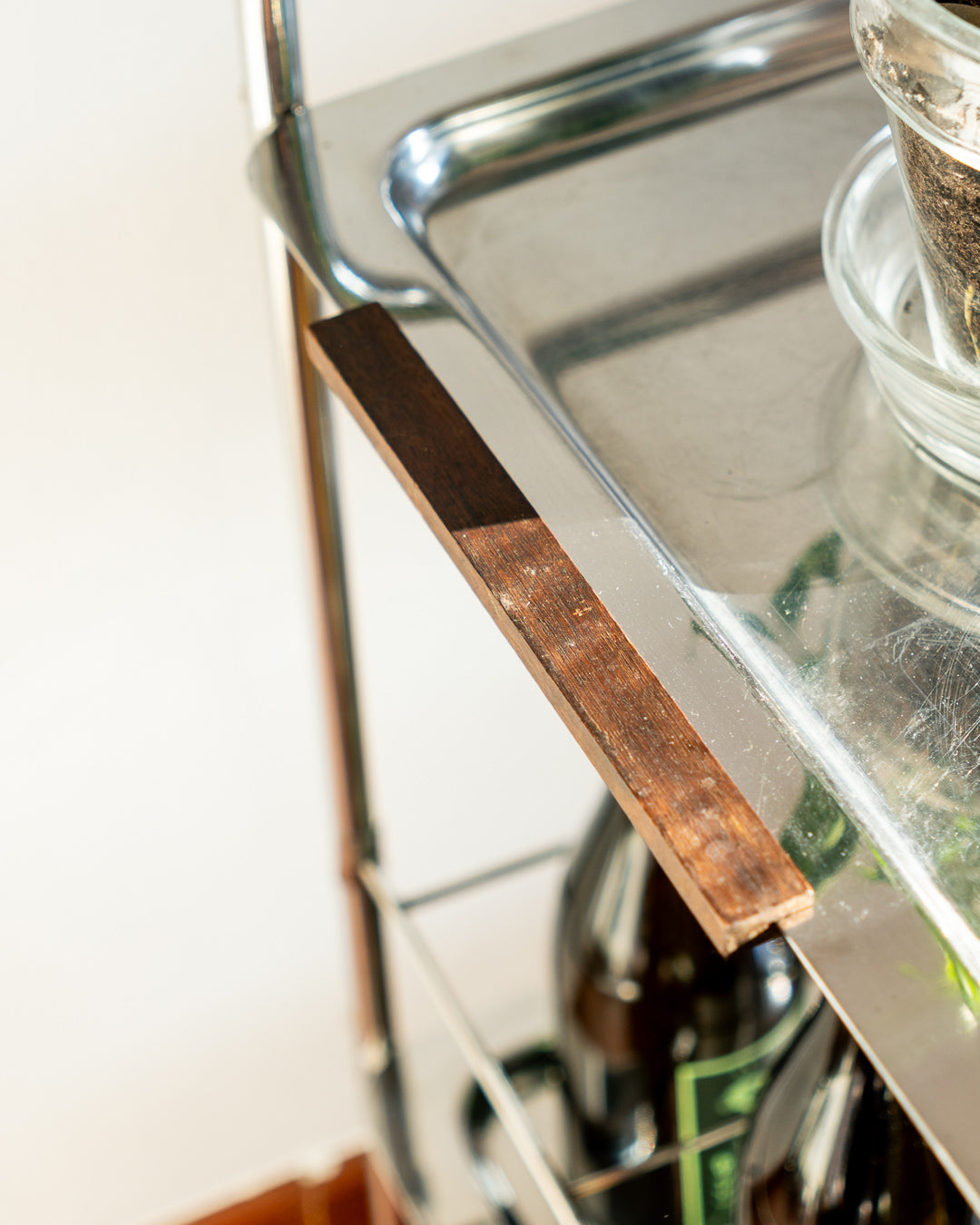 Vintage mid century modern stainless steel and chrome two-tier bar cart with teak handles and bottle divider, 1970s