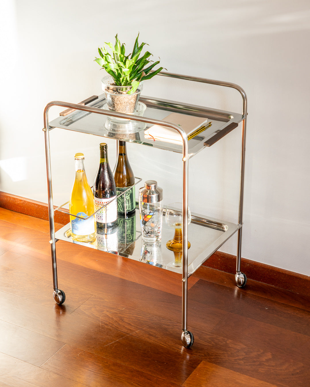 Vintage mid century modern stainless steel and chrome two-tier bar cart with teak handles and bottle divider, 1970s