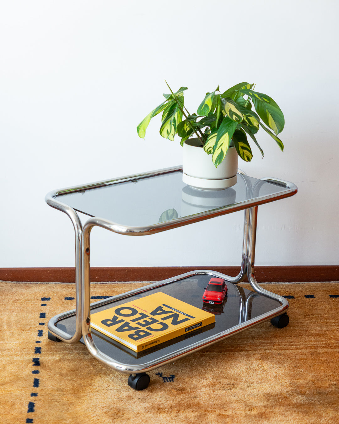 Vintage 1970s chrome side table with two smoked glass shelves – Vecino Shop