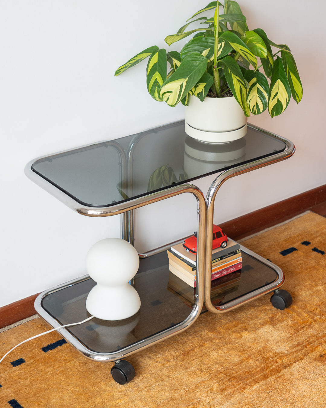 Vintage 1970s chrome side table with two smoked glass shelves – Vecino Shop