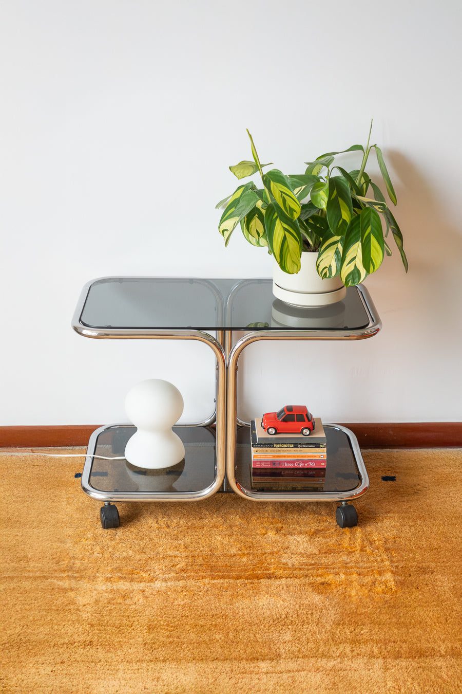 Vintage 1970s chrome side table with two smoked glass shelves – Vecino Shop