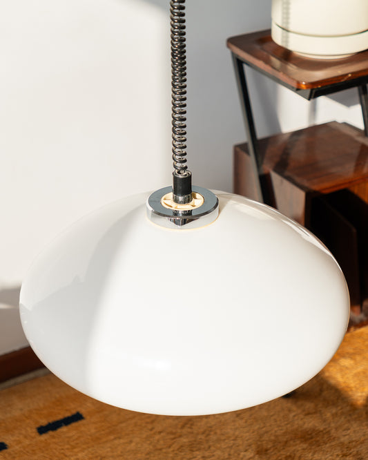 Retro 1960s/70s extendable Space Age ceiling lamp with white plastic shade, chrome accents, and black spiral cord. Sculptural, functional, and iconic.