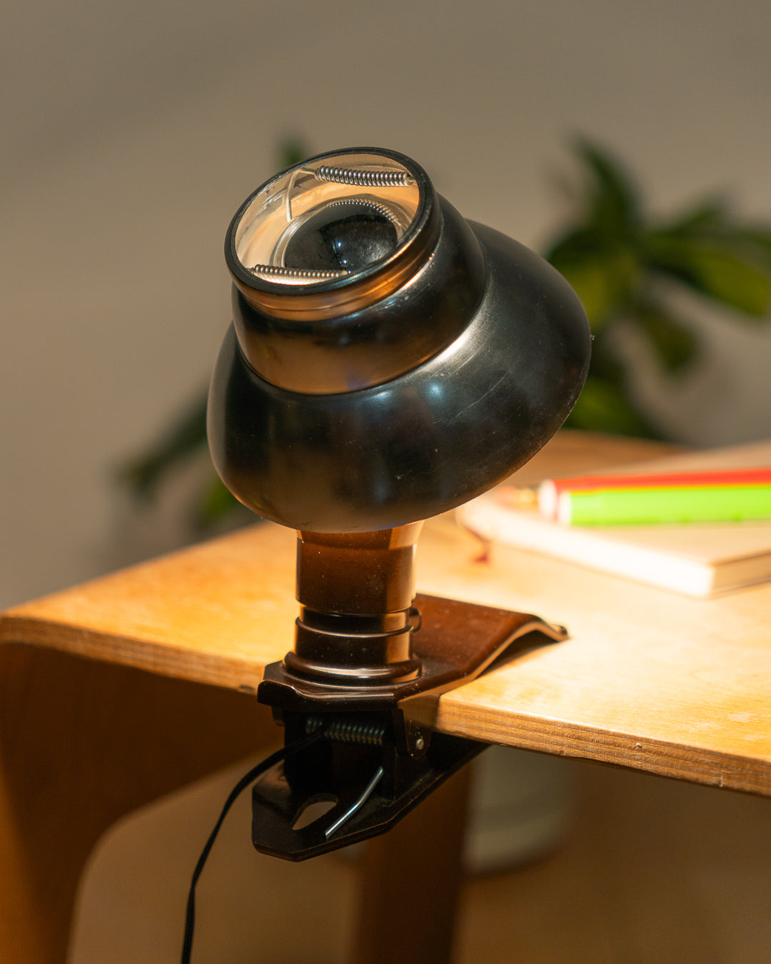 Vintage 1970s aluminum mini mushroom clip lamp with space age design and Bakelite clip base. Compact retro lighting piece from Vecino Shop.