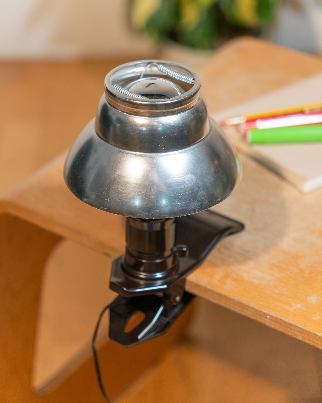 Vintage 1970s aluminum mini mushroom clip lamp with space age design and Bakelite clip base. Compact retro lighting piece from Vecino Shop.