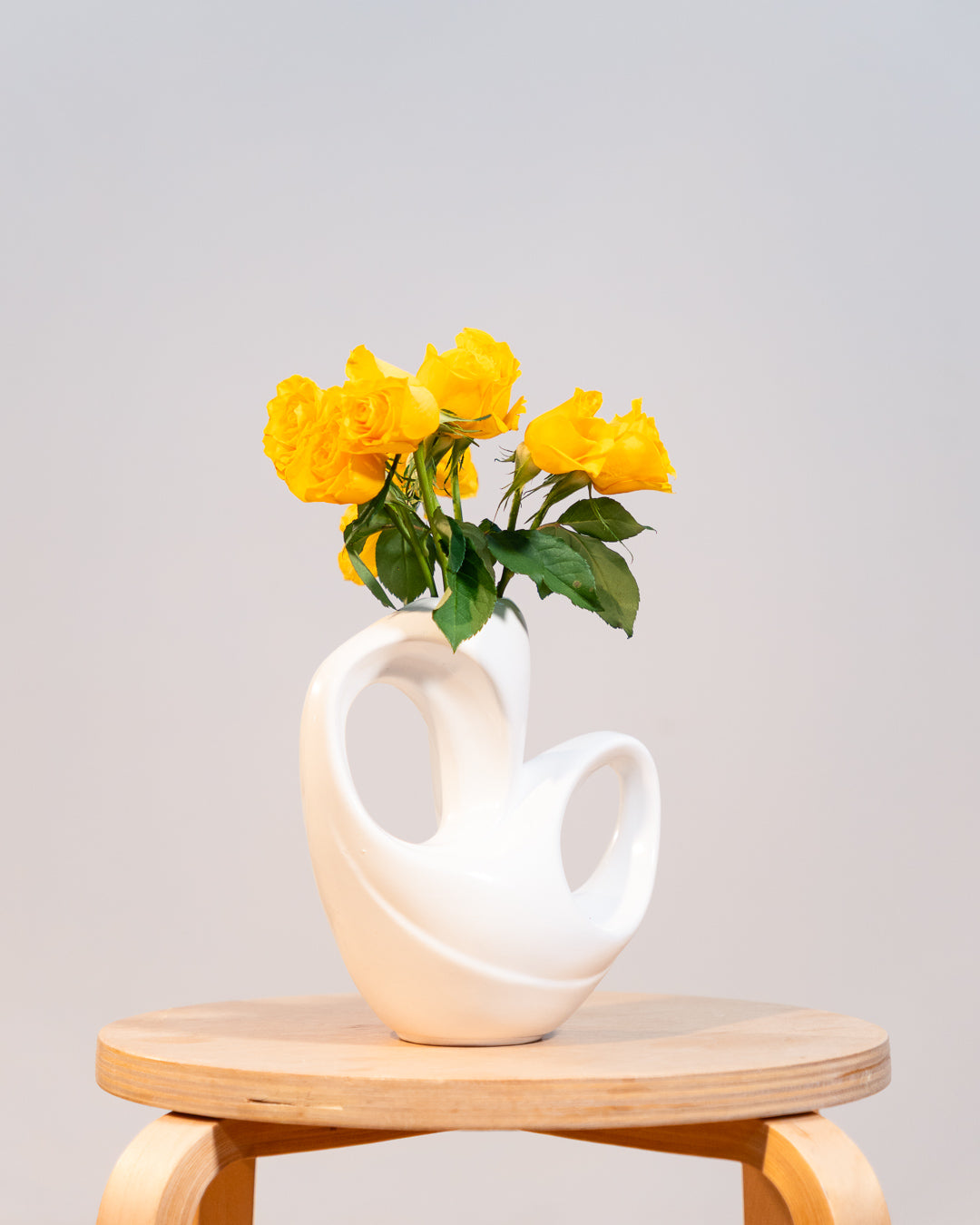 Vintage white glazed ceramic abstract vase from the 1980s with double handle detail. Vecino Shop