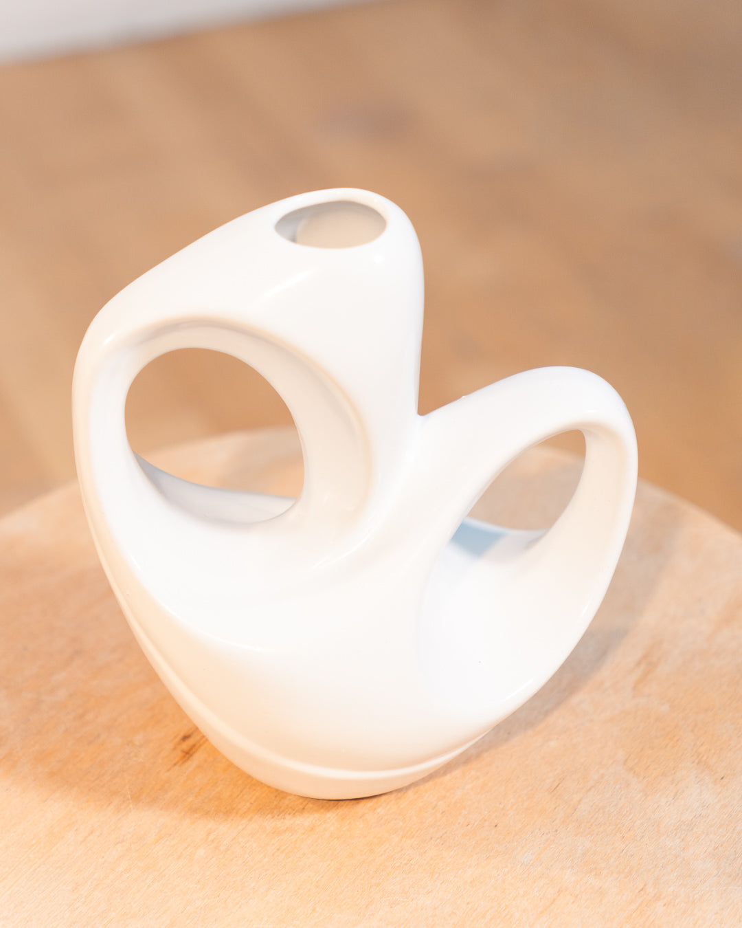 Vintage white glazed ceramic abstract vase from the 1980s with double handle detail. Vecino Shop