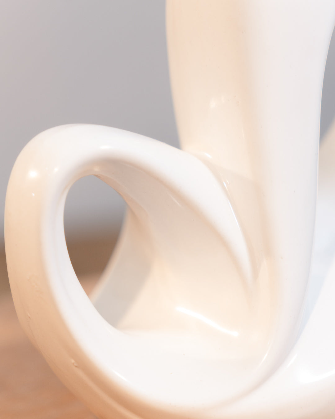 Vintage white glazed ceramic abstract vase from the 1980s with double handle detail. Vecino Shop