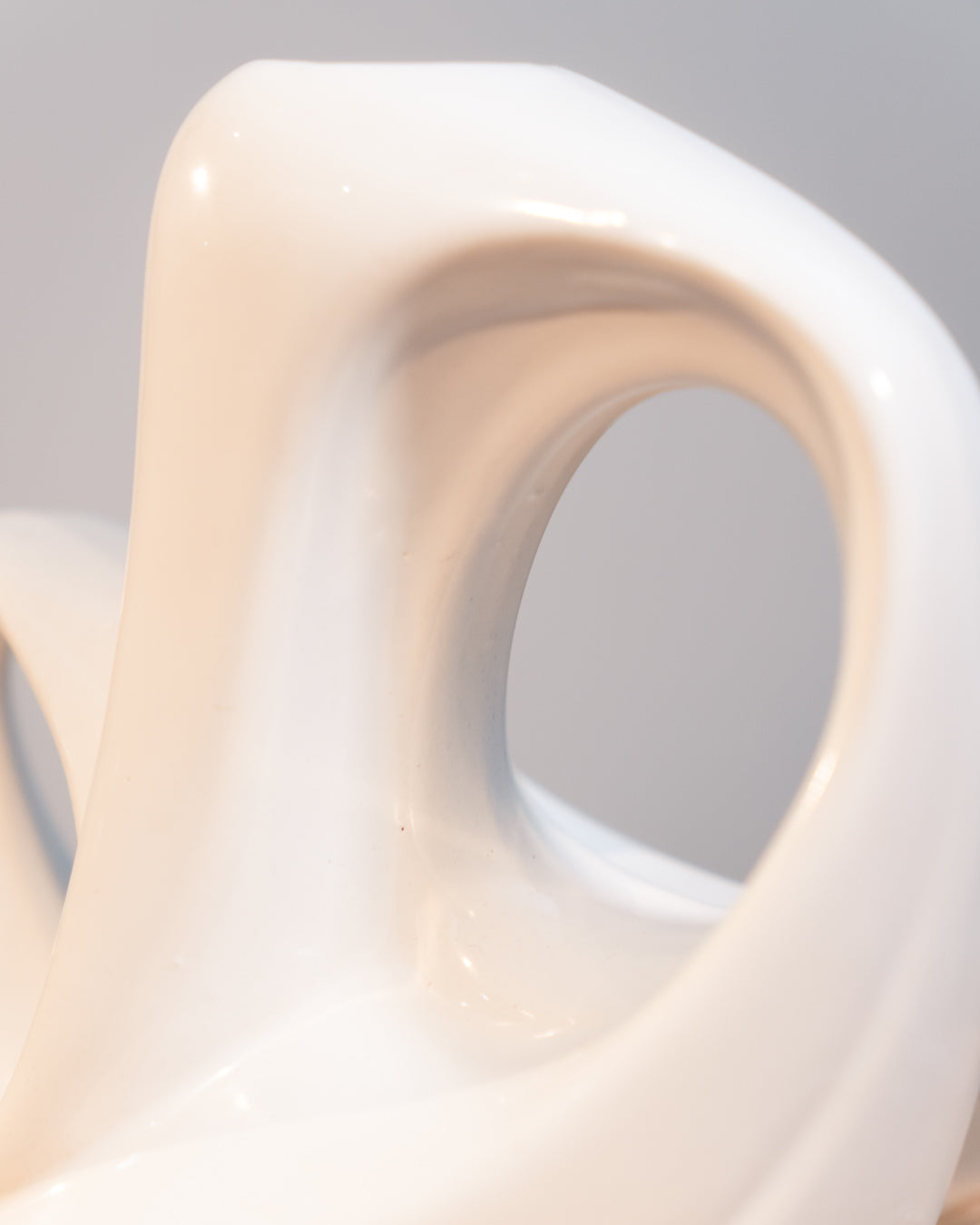 Vintage white glazed ceramic abstract vase from the 1980s with double handle detail. Vecino Shop