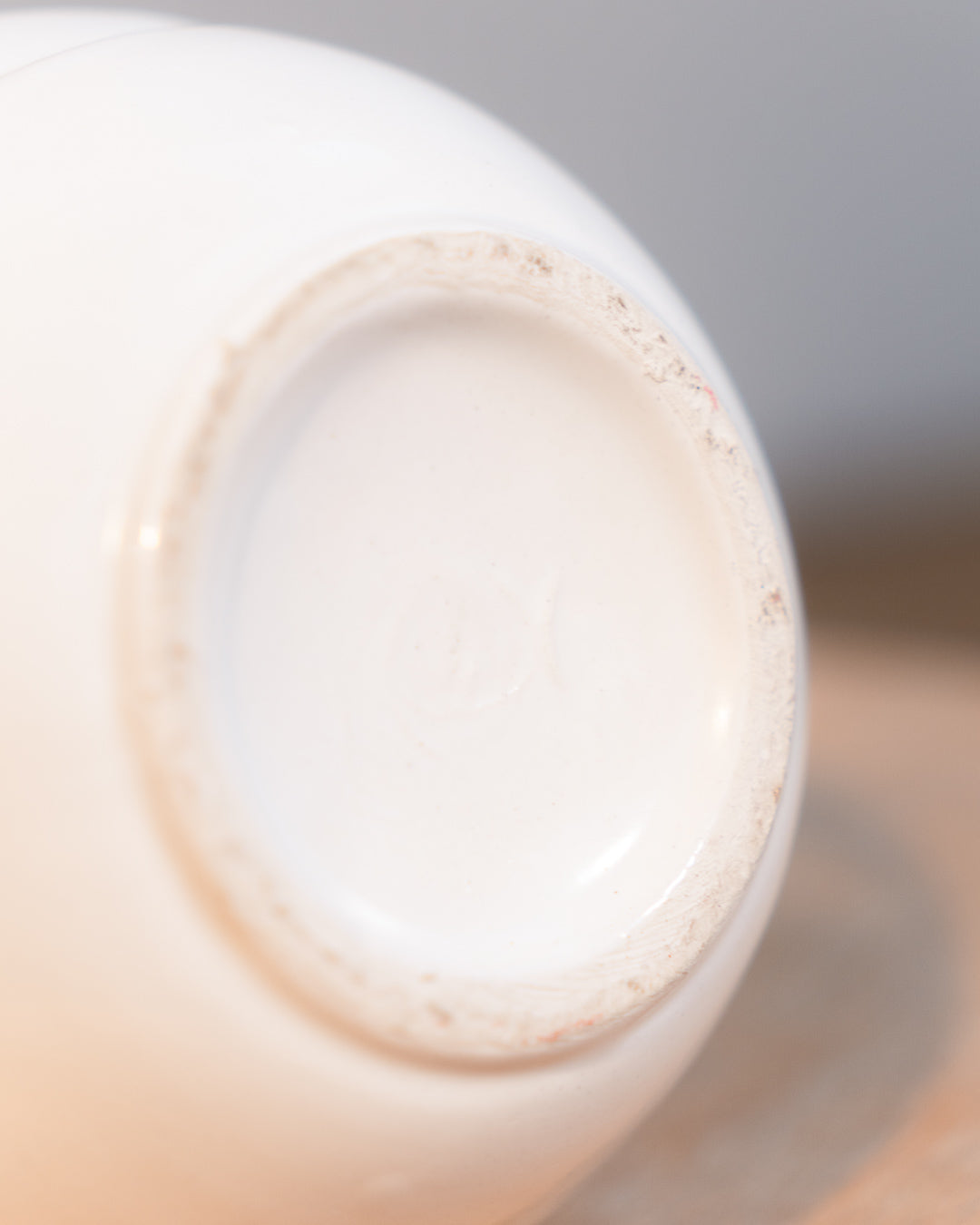 Vintage white glazed ceramic abstract vase from the 1980s with double handle detail. Vecino Shop