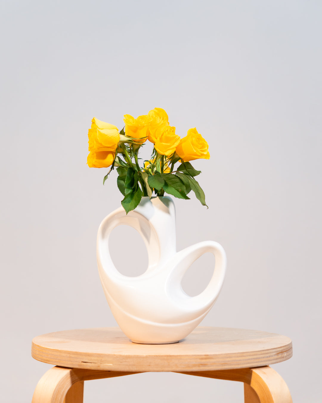 Vintage white glazed ceramic abstract vase from the 1980s with double handle detail. Vecino Shop